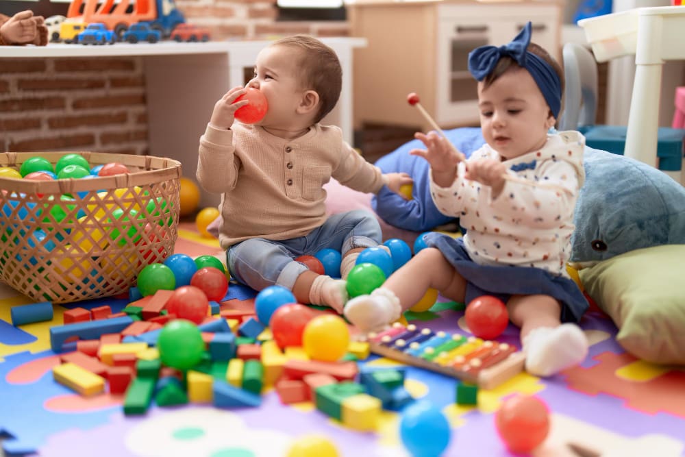 children in daycare center playing with toys children in daycare center playing with toys