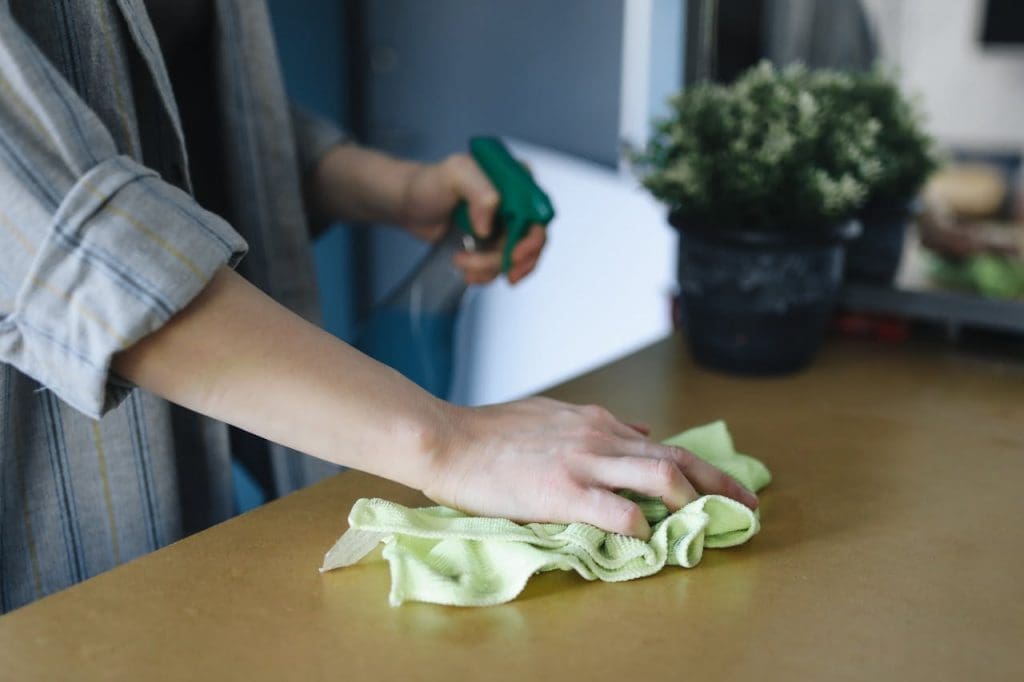 wiping down table