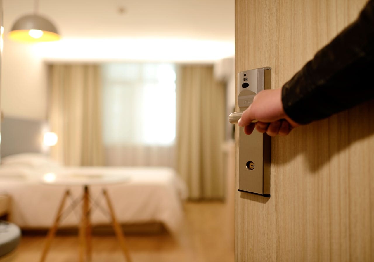 man entering hotel room man entering hotel room